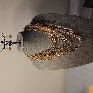 Gold toned necklace and earrings